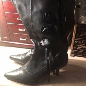 Knee high Black boots w rosettes on side